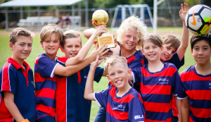 Suncoast Football Academy Players holding trophy